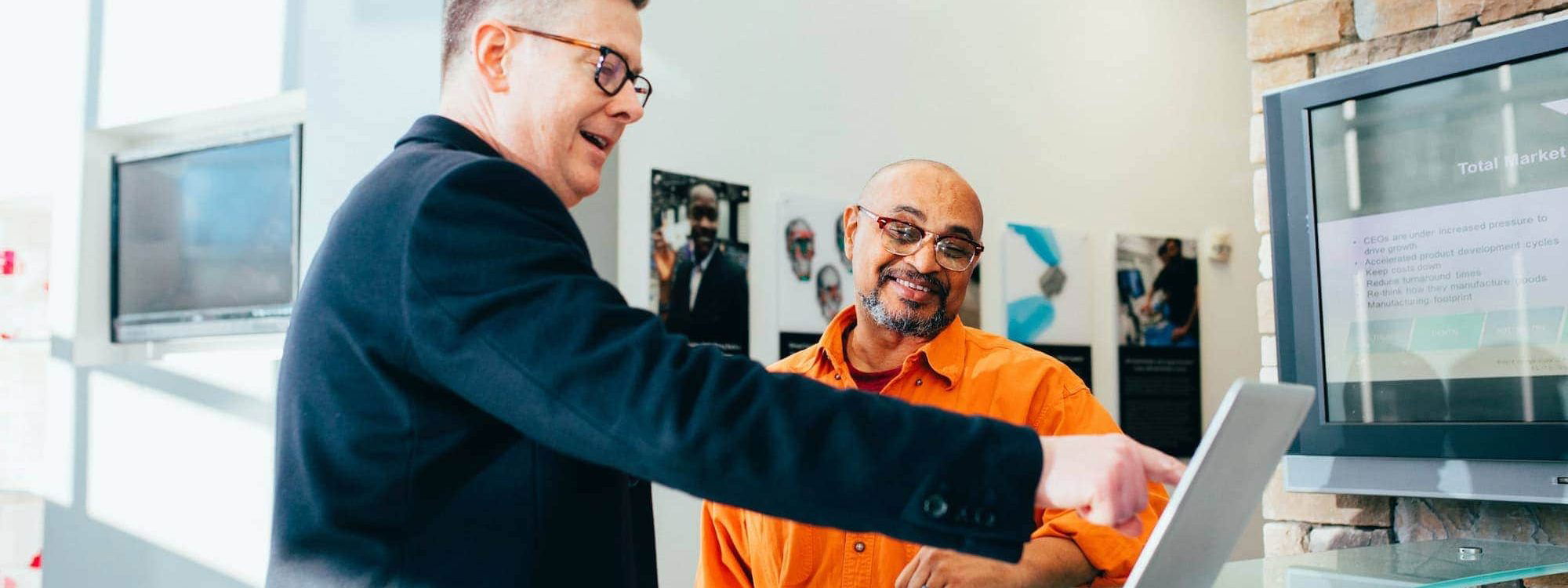 Two men in a meeting with laptop