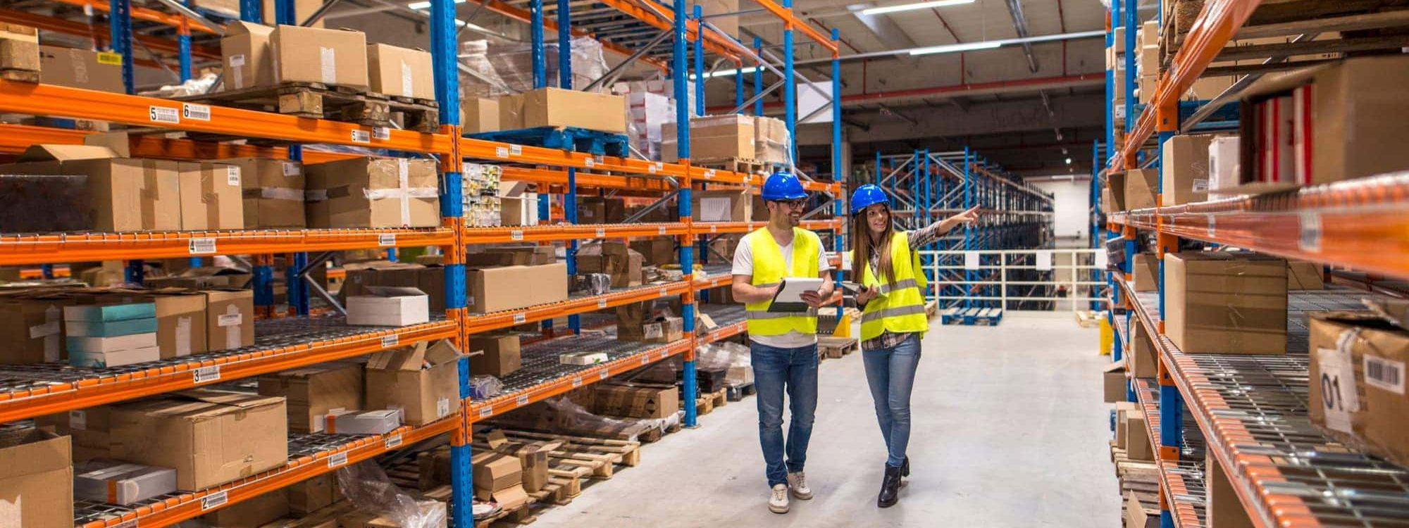 Warehouse managers walking through logistics wareouse