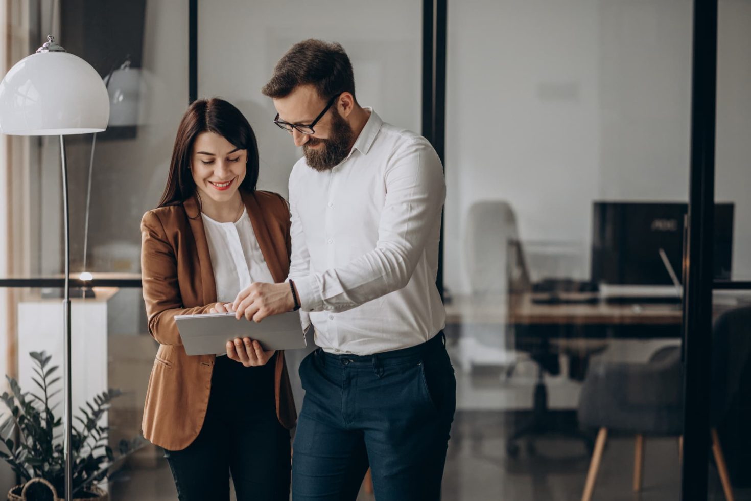 Business partners in an office using a tablet